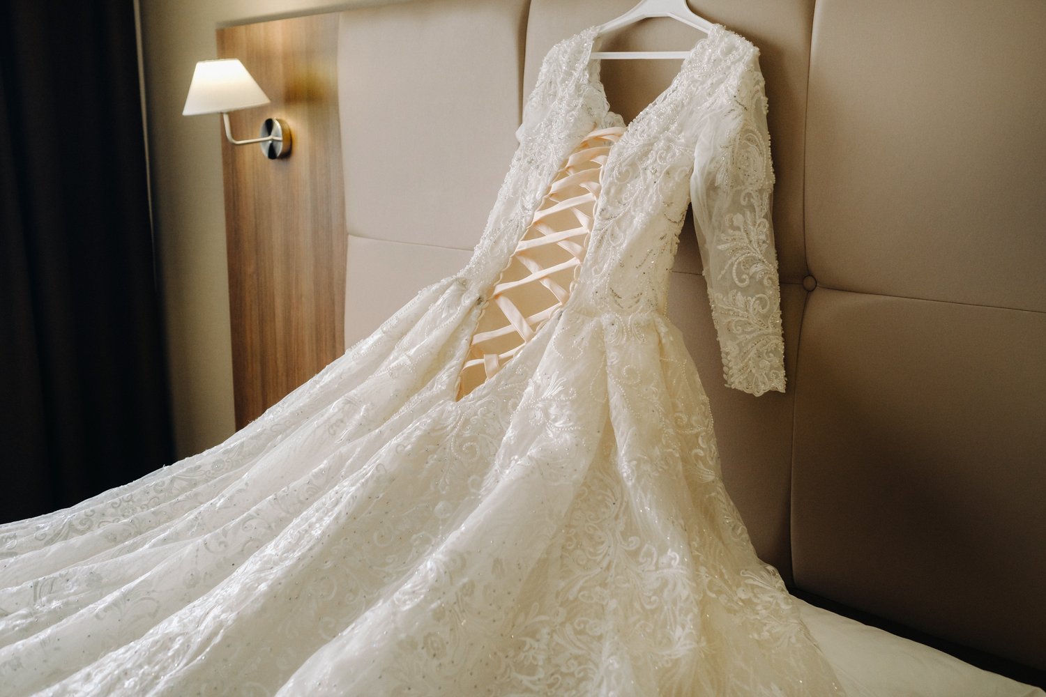 a-large-white-wedding-dress-on-a-hanger-is-lying-o-2023-11-27-04-53-26-utc