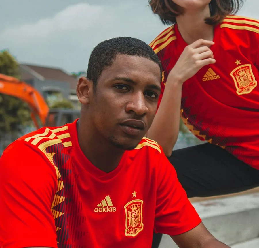 Man wearing a red football shirt