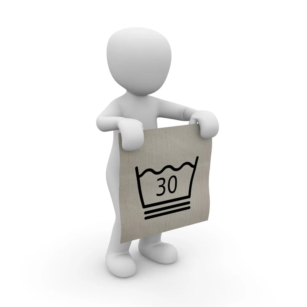 Illustration of a person holding a fabric care label